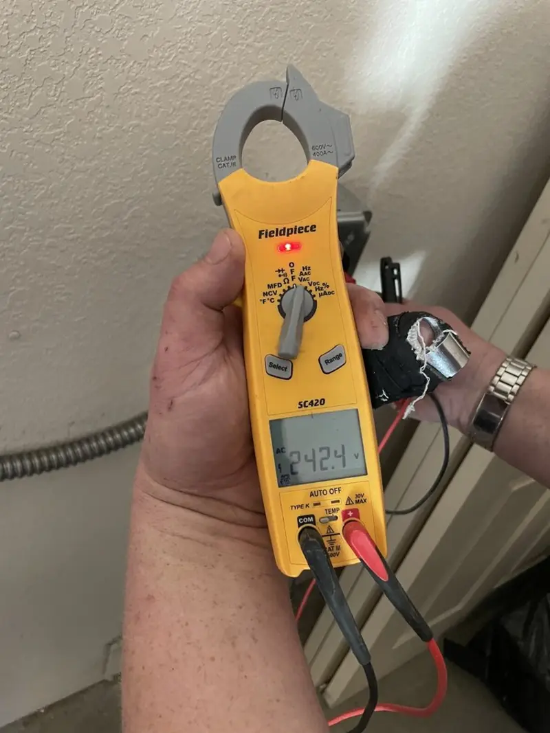 Voltage testing with clamp meter during Outlet Installation in Midway